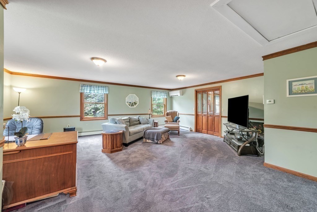 4 Stony Hill Road Hampden, MA 01036 - Photo 18 of 40 a living room with furniture and a flat screen tv