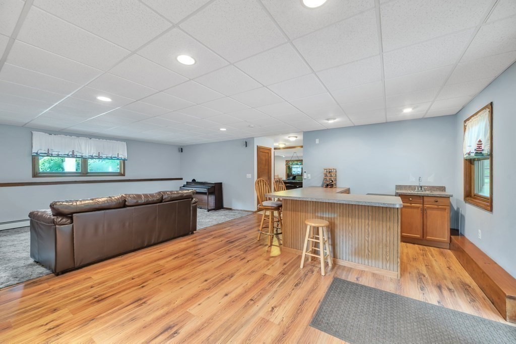 4 Stony Hill Road Hampden, MA 01036 - Photo 27 of 40 a living room with furniture and a wooden floor