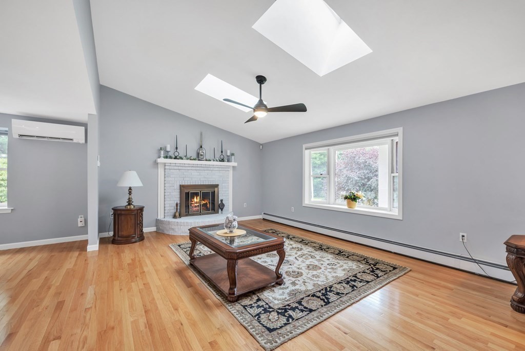 4 Stony Hill Road Hampden, MA 01036 - Photo 3 of 40 a living room with furniture and a fireplace