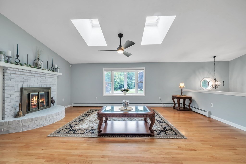 4 Stony Hill Road Hampden, MA 01036 - Photo 4 of 40 a living room with furniture and a fireplace