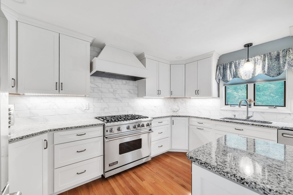 4 Stony Hill Road Hampden, MA 01036 - Photo 9 of 40 a kitchen with granite countertop white cabinets and white stainless steel appliances