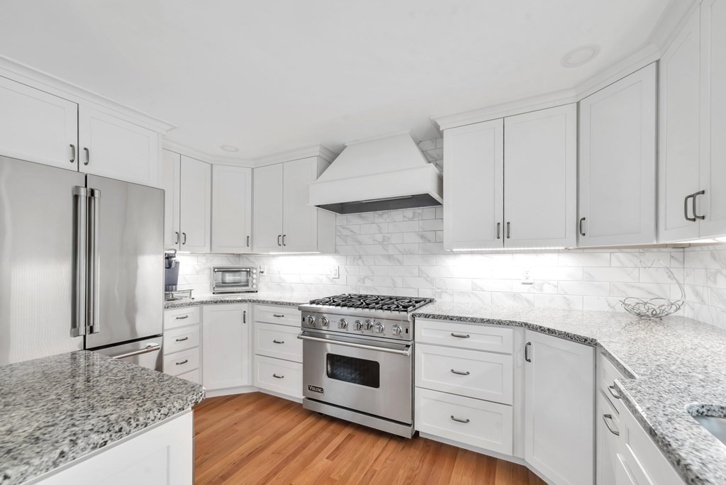 4 Stony Hill Road Hampden, MA 01036 - Photo 10 of 40 a kitchen with granite countertop white cabinets and stainless steel appliances