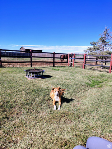 5264 West 5500th Street South Hooper, UT 84315 - Photo 5 of 20 Fenced backyard with a fire pit