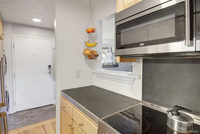 a kitchen with a sink cabinets and appliances