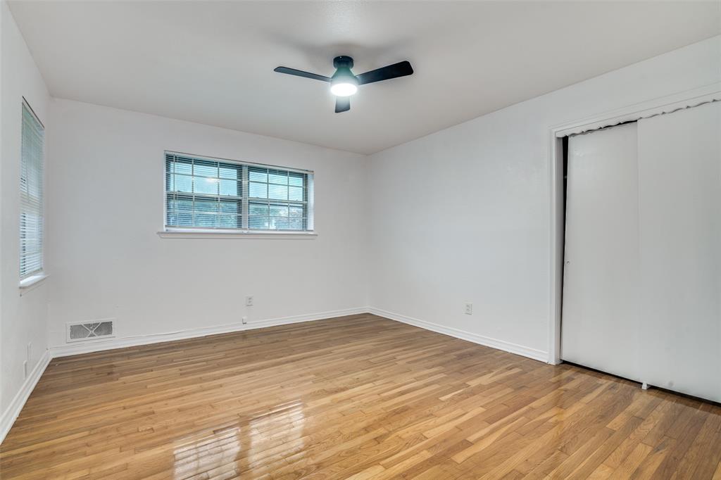 3308 Ranch Drive Garland, TX 75041 - Photo 20 of 25 a view of empty room with wooden floor and fan