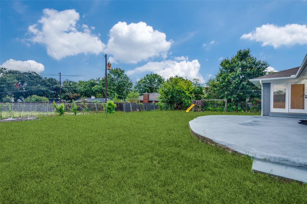 3308 Ranch Drive Garland, TX 75041 - Photo 22 of 25 a view of a house with a backyard