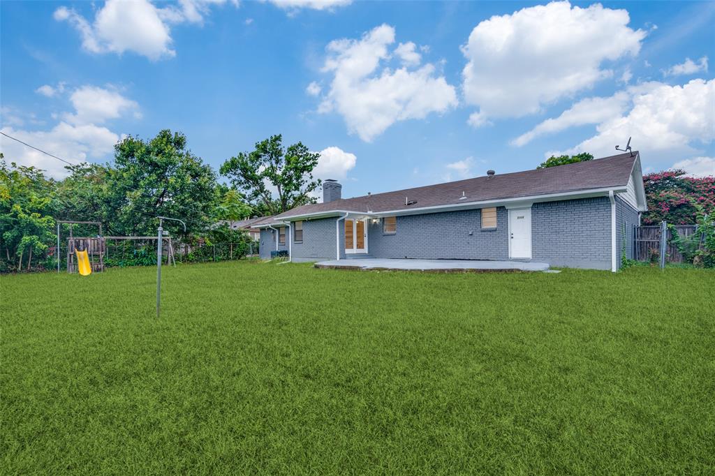 3308 Ranch Drive Garland, TX 75041 - Photo 23 of 25 a front view of a house with garden
