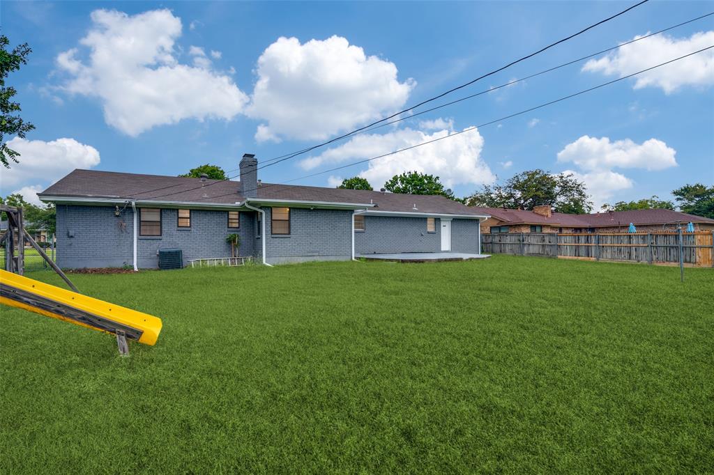 3308 Ranch Drive Garland, TX 75041 - Photo 24 of 25 a view of a house with a backyard