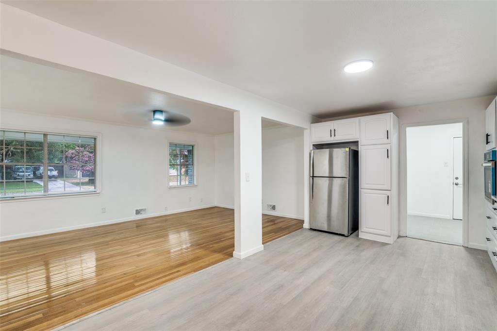 3308 Ranch Drive Garland, TX 75041 - Photo 9 of 25 a view of empty room with wooden floor