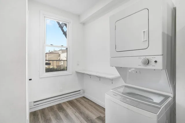 a bathroom with a sink a mirror and a shower curtain