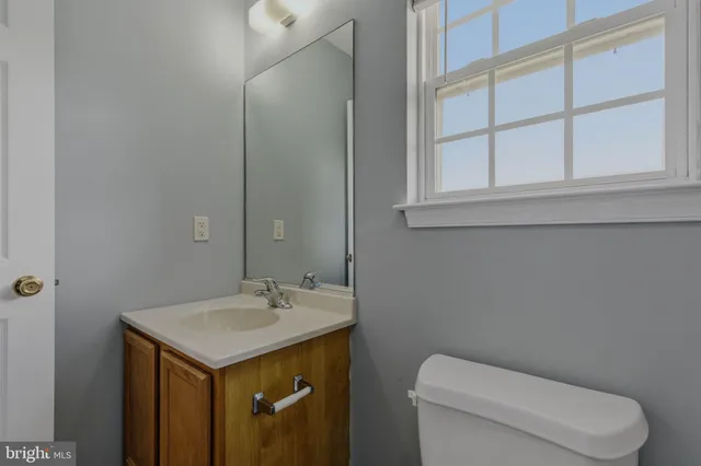 a bathroom with a toilet and bathtub