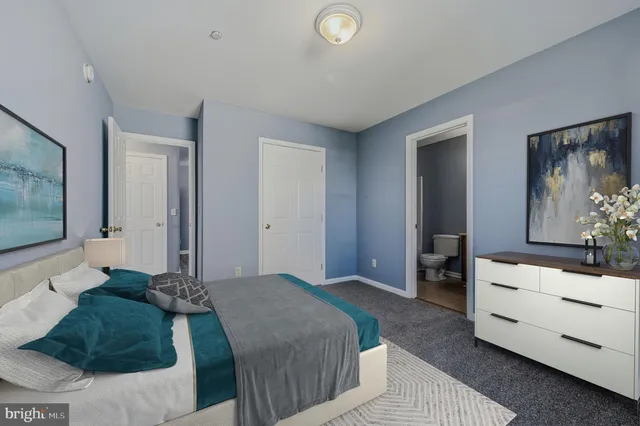 a living room with furniture flat screen tv and wooden floor