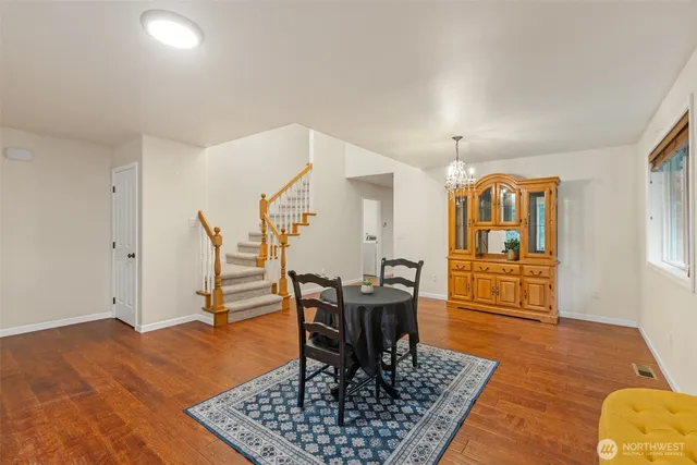 a workspace room with furniture and wooden floor
