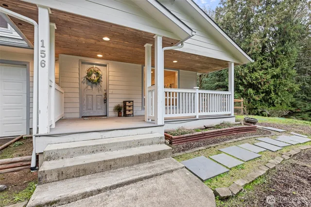 a view of a house with a backyard