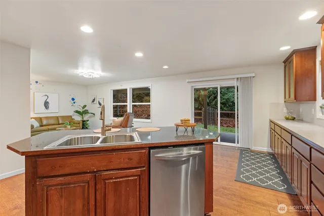 a kitchen with counter top space and sink