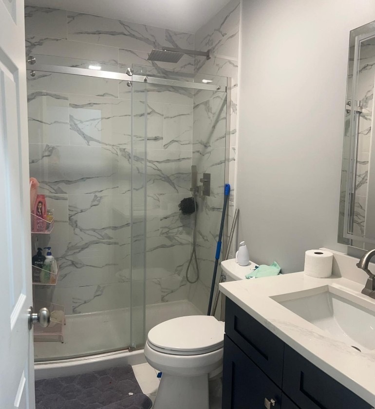 1051 North Springfield Avenue Chicago, IL 60651 - Photo 9 of 50 a bathroom with a sink toilet and shower