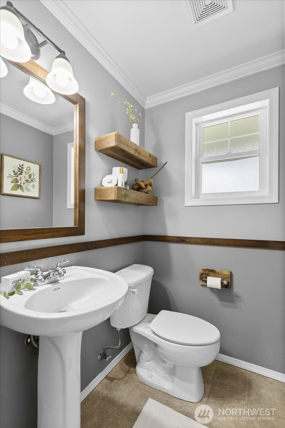 208 Shantel Street Mount Vernon, WA 98274 - Photo 11 of 31 a bathroom with a sink a toilet and a mirror