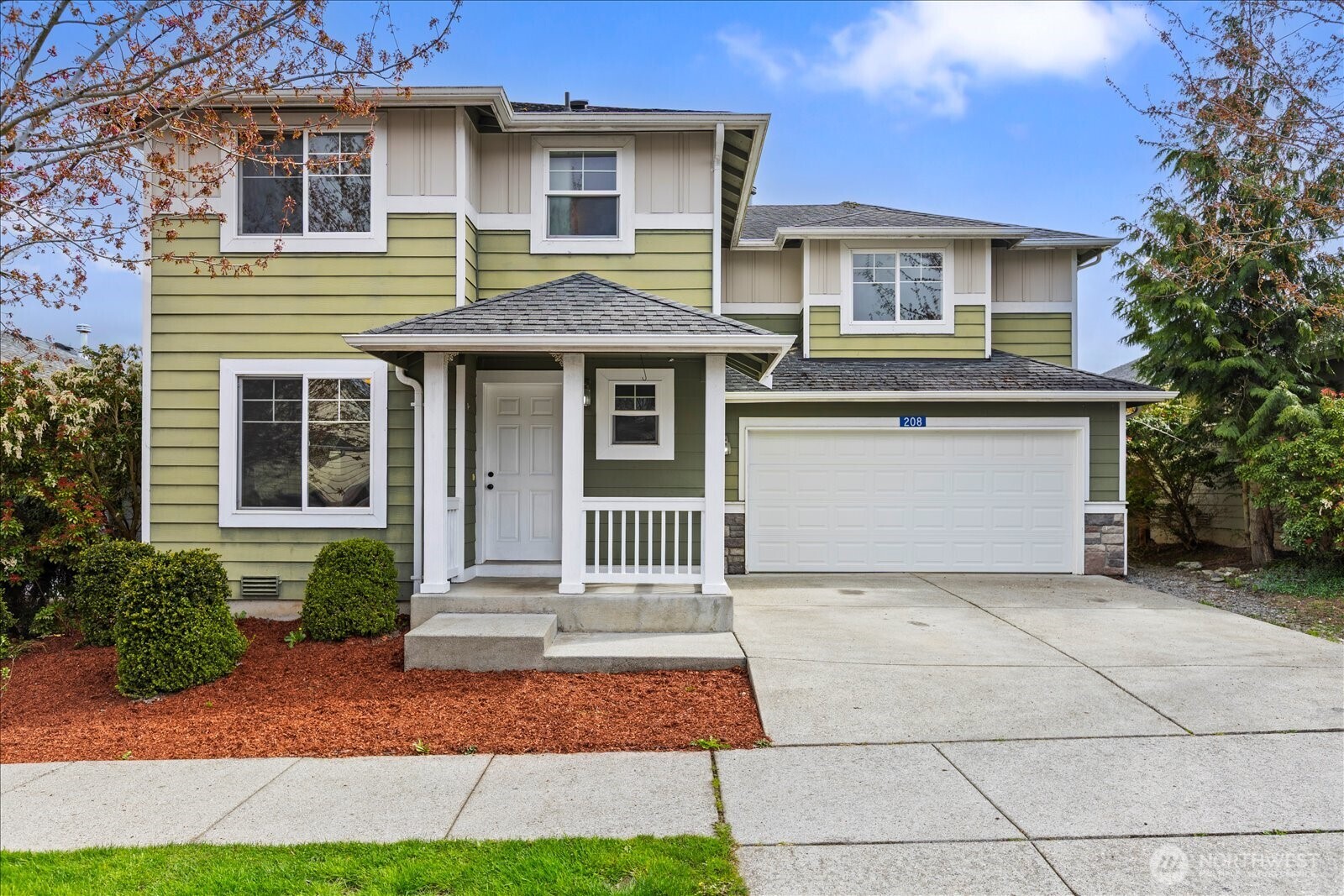 208 Shantel Street Mount Vernon, WA 98274 - Photo 2 of 31 a front view of a house with a garage