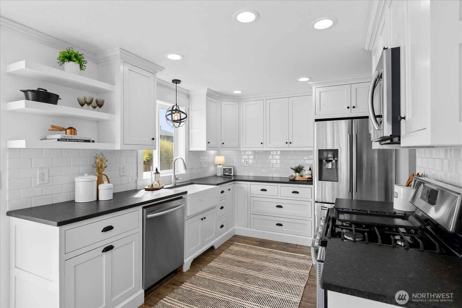 208 Shantel Street Mount Vernon, WA 98274 - Photo 8 of 31 a kitchen with white cabinets and refrigerator