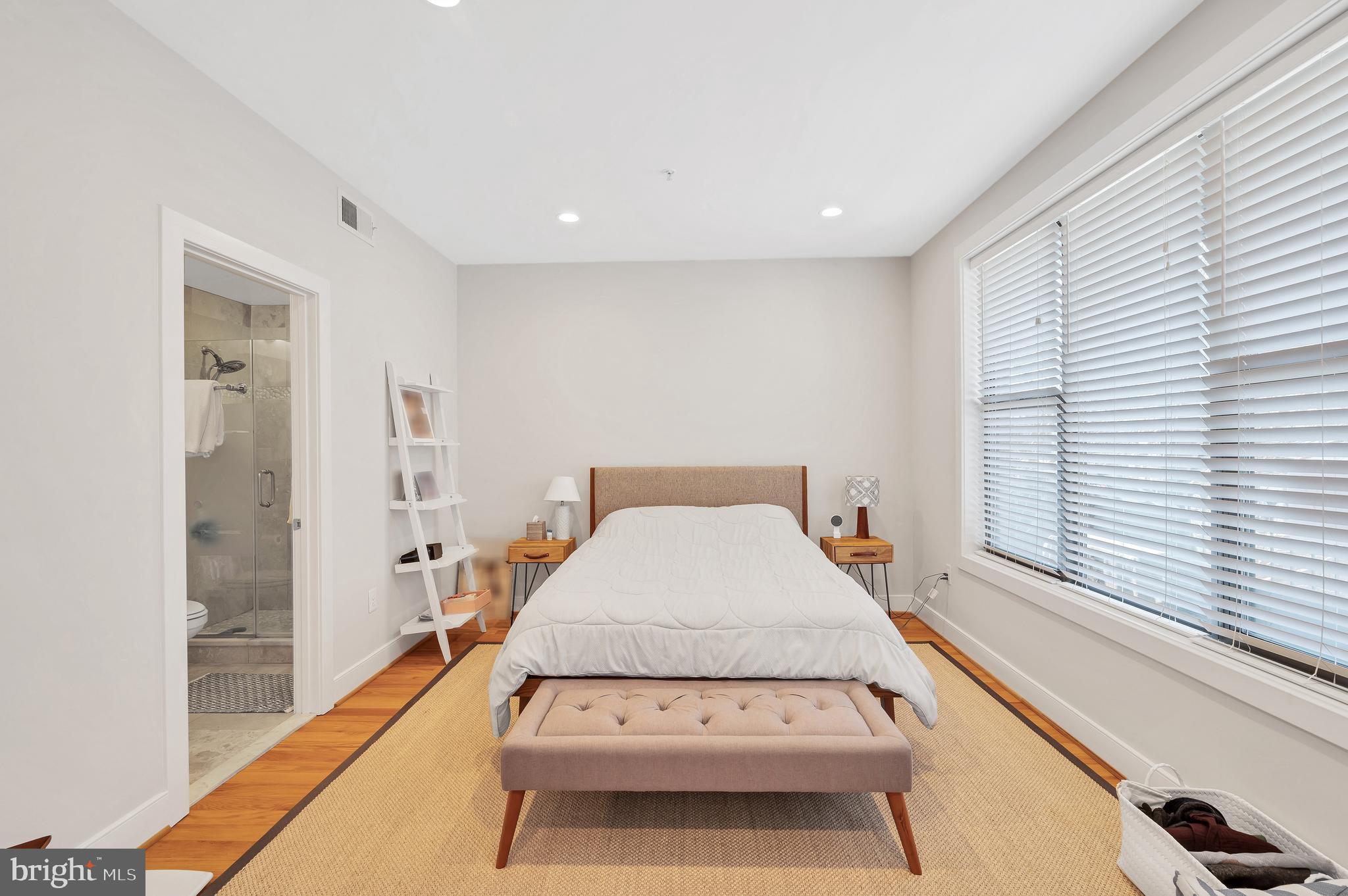 2444 Ontario Road Northwest, Unit 2 Washington, DC 20009 - Photo 12 of 29 a bedroom with a bed and a large window