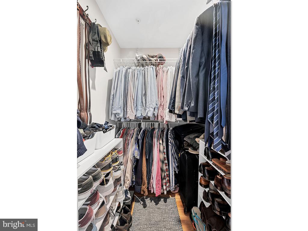 2444 Ontario Road Northwest, Unit 2 Washington, DC 20009 - Photo 17 of 29 a view of walk in closet with clothes and shoes