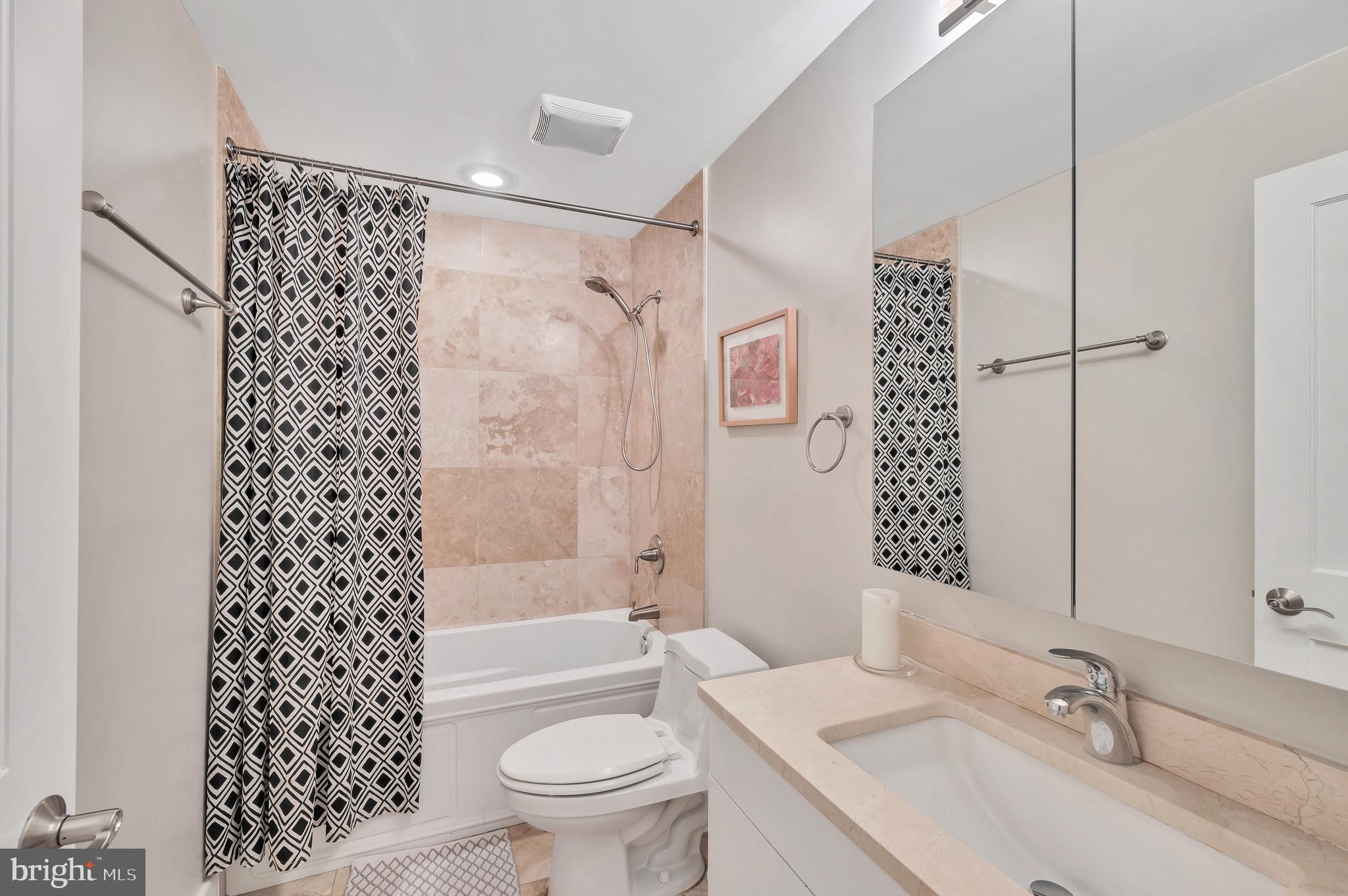 2444 Ontario Road Northwest, Unit 2 Washington, DC 20009 - Photo 21 of 29 a bathroom with a sink toilet and shower