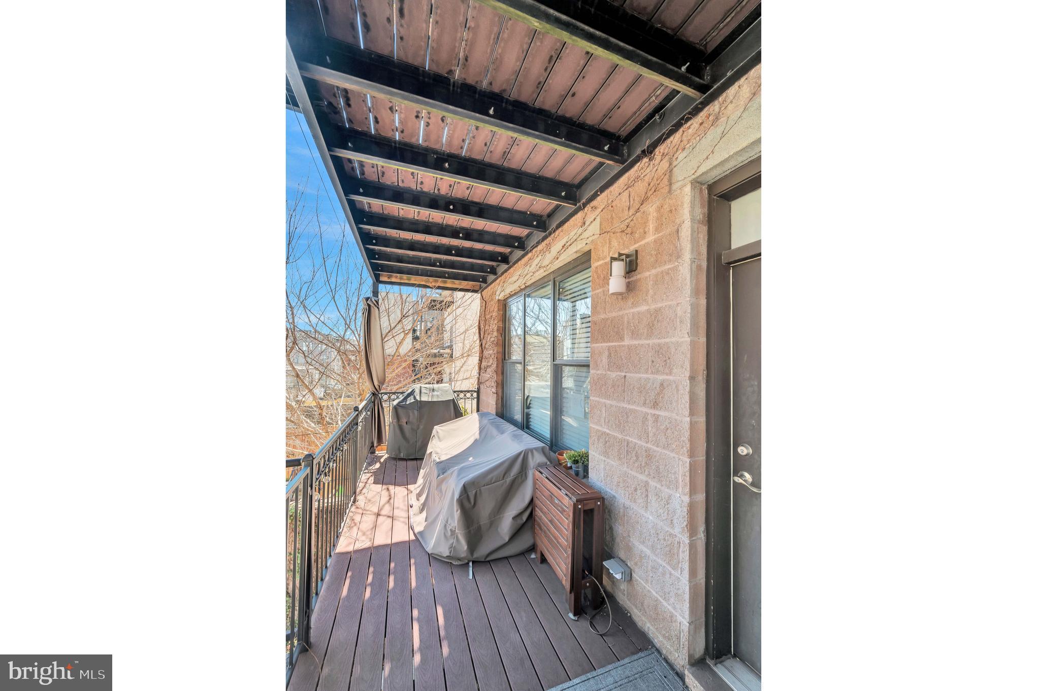 2444 Ontario Road Northwest, Unit 2 Washington, DC 20009 - Photo 23 of 29 a living room with a couch and wooden floor
