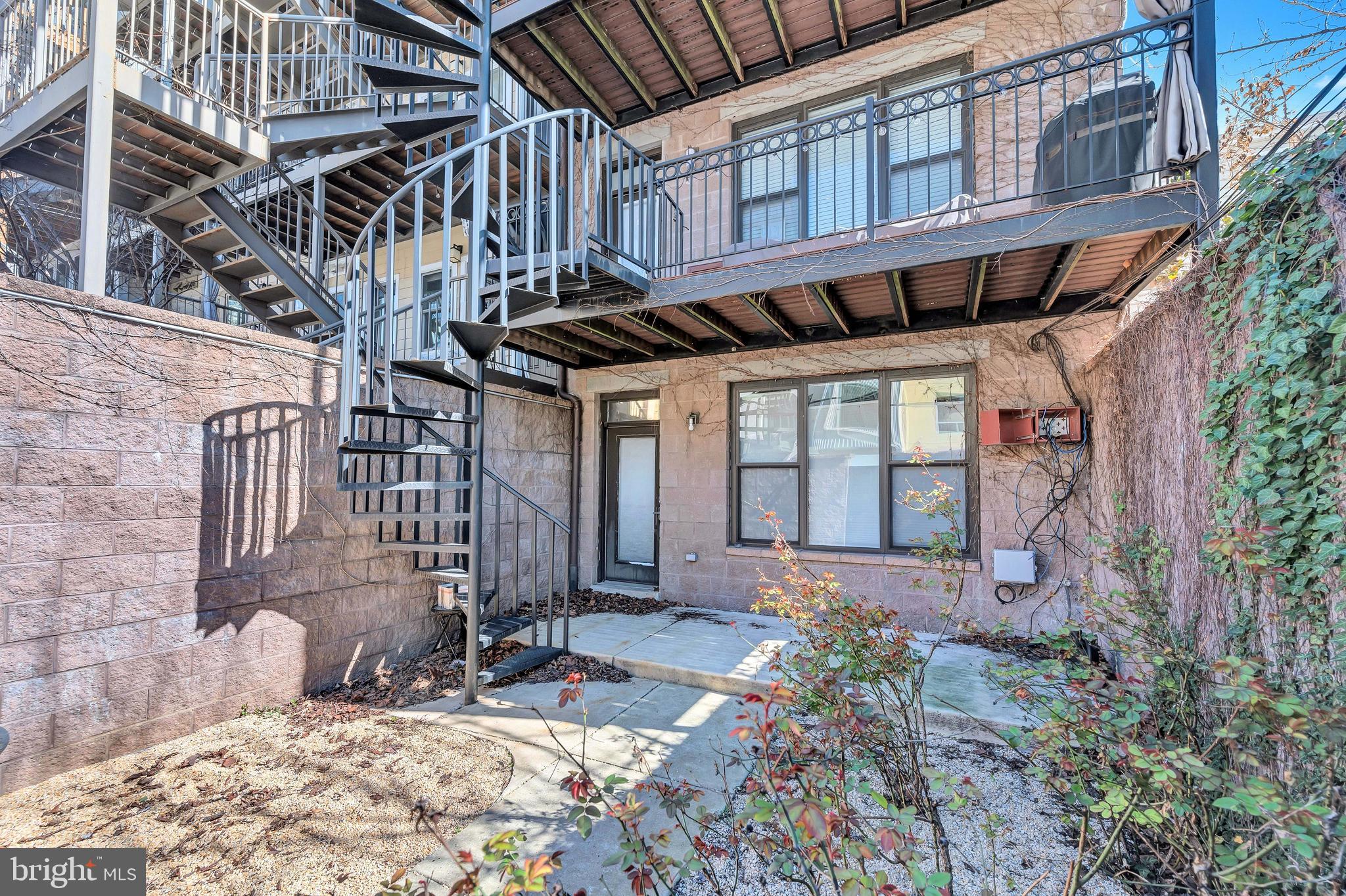 2444 Ontario Road Northwest, Unit 2 Washington, DC 20009 - Photo 25 of 29 front view of a house with a yard