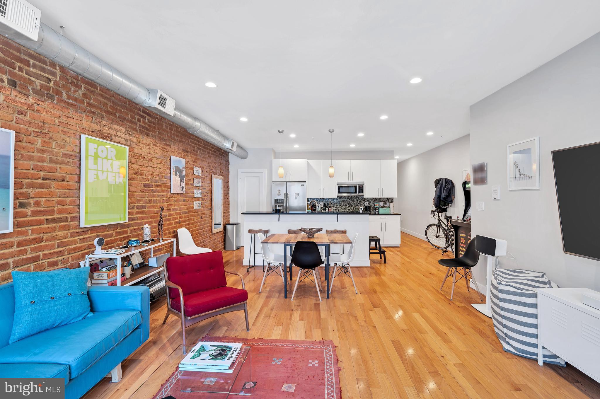 2444 Ontario Road Northwest, Unit 2 Washington, DC 20009 - Photo 5 of 29 a living room with furniture and a wooden floor