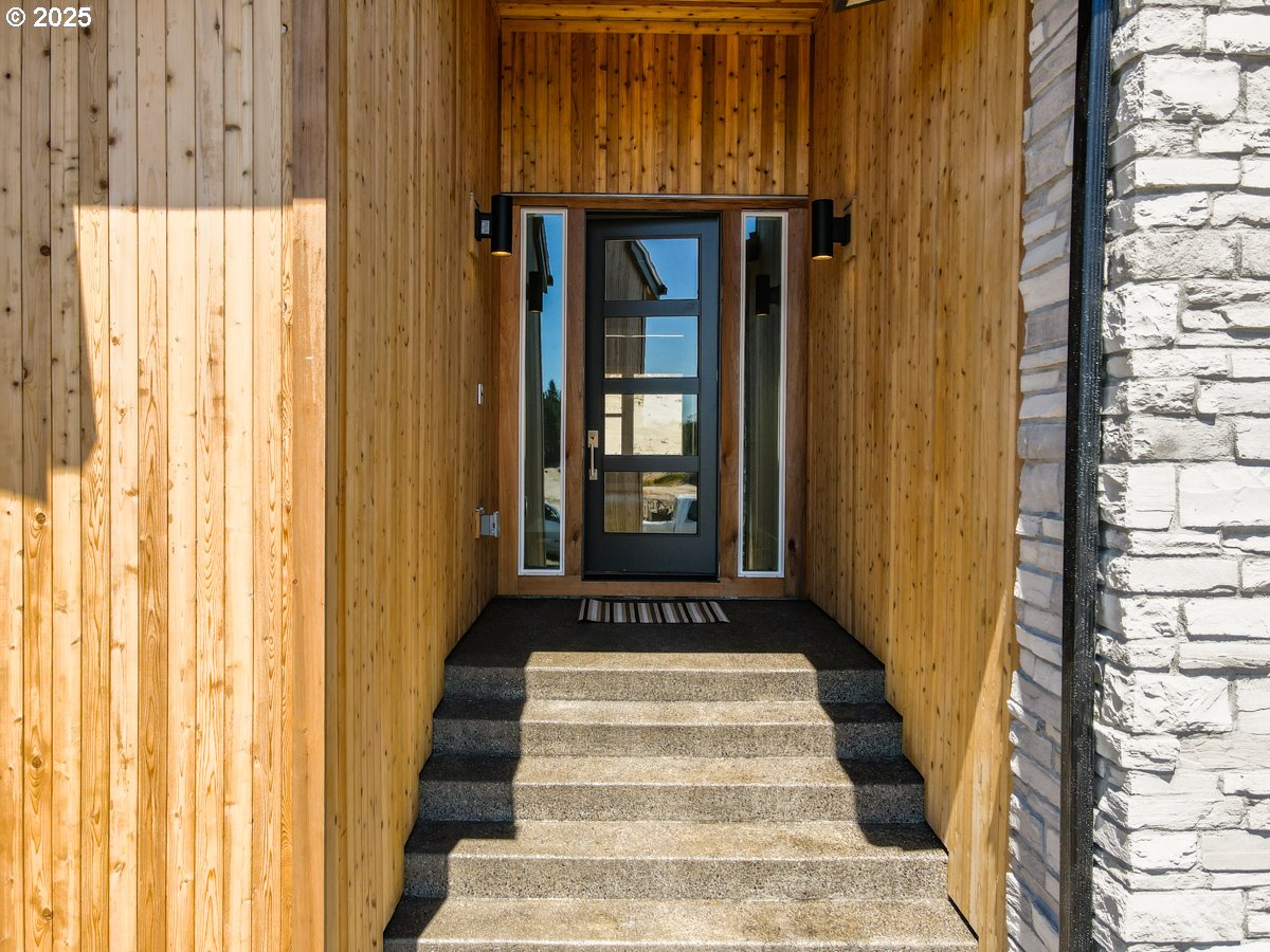 413 Meadows Drive Nehalem, OR 97131 - Photo 2 of 13 a view of a entryway door with wooden floor