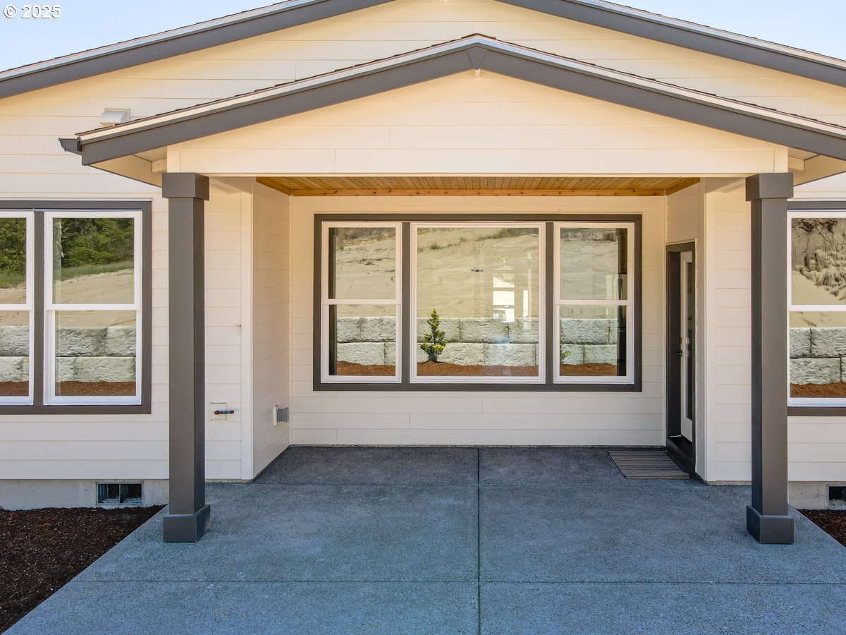 413 Meadows Drive Nehalem, OR 97131 - Photo 3 of 13 a view of an empty room with a window