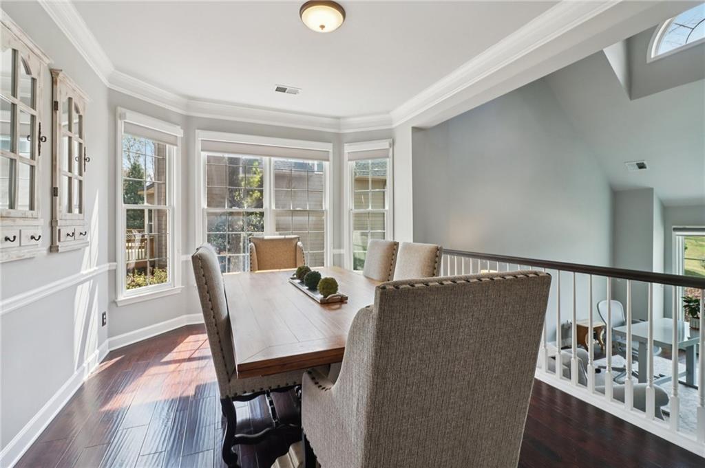 5840 Masters Club Drive Suwanee, GA 30024 - Photo 20 of 72 a view of a dining room with furniture window and wooden floor