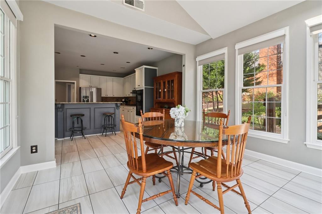 5840 Masters Club Drive Suwanee, GA 30024 - Photo 22 of 72 a view of a dining room with furniture window and outside view