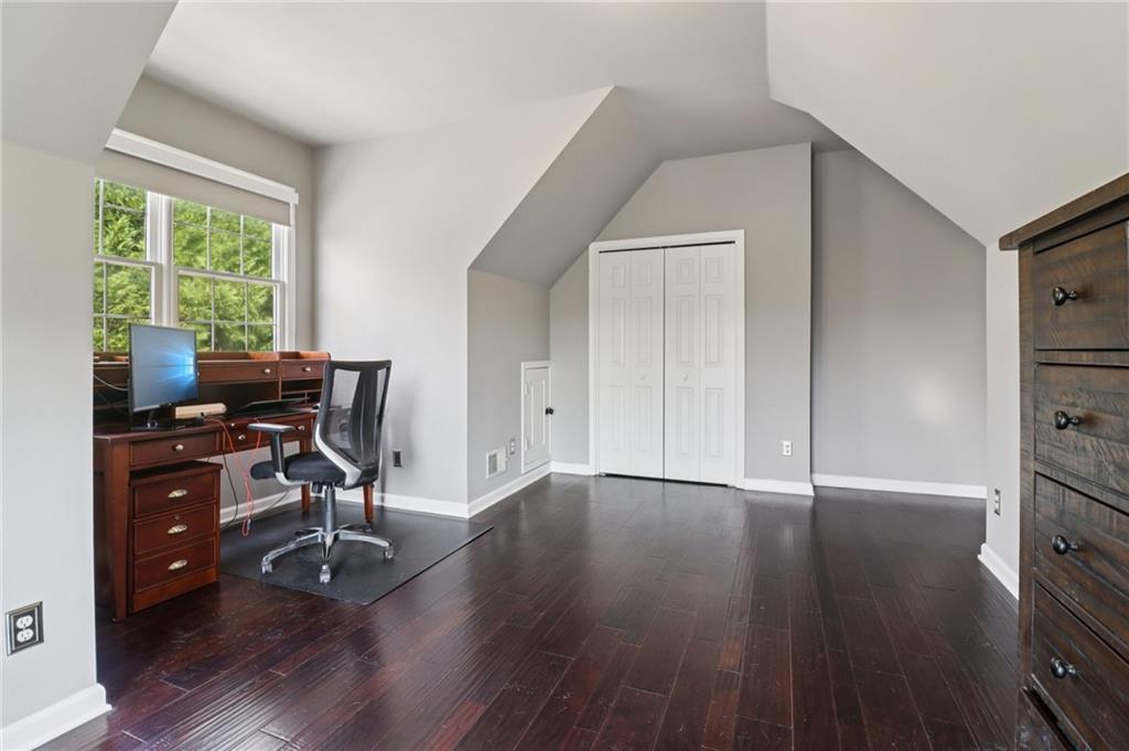 5840 Masters Club Drive Suwanee, GA 30024 - Photo 40 of 72 a view of a workspace with furniture and a window