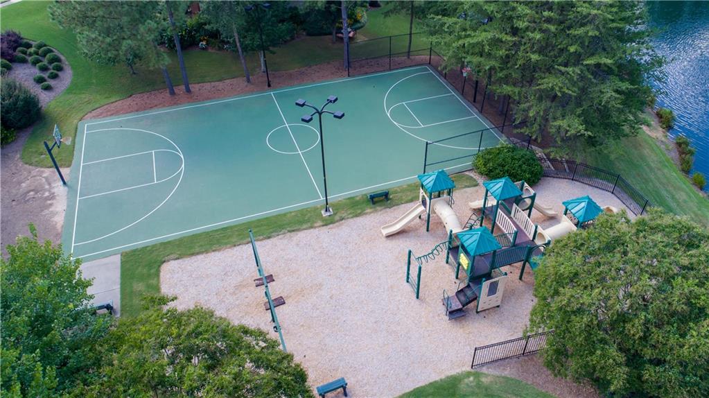 5840 Masters Club Drive Suwanee, GA 30024 - Photo 64 of 72 an aerial view of a tennis ground and large trees