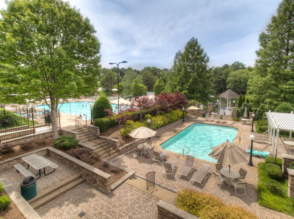 5840 Masters Club Drive Suwanee, GA 30024 - Photo 65 of 72 a view of a backyard with sitting area