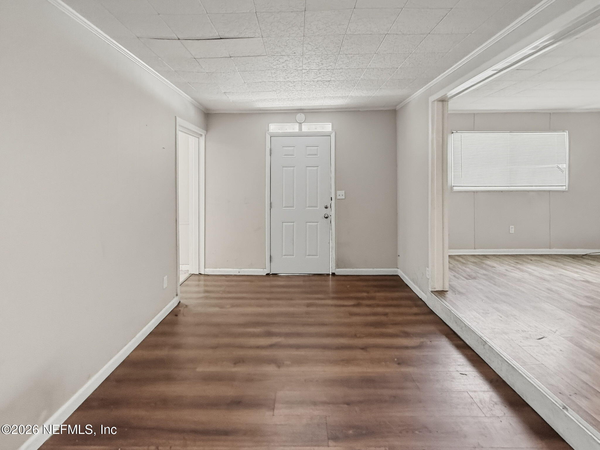 326 Cahoon Road South Jacksonville, FL 32220 - Photo 10 of 34 a view of an empty room and wooden floor