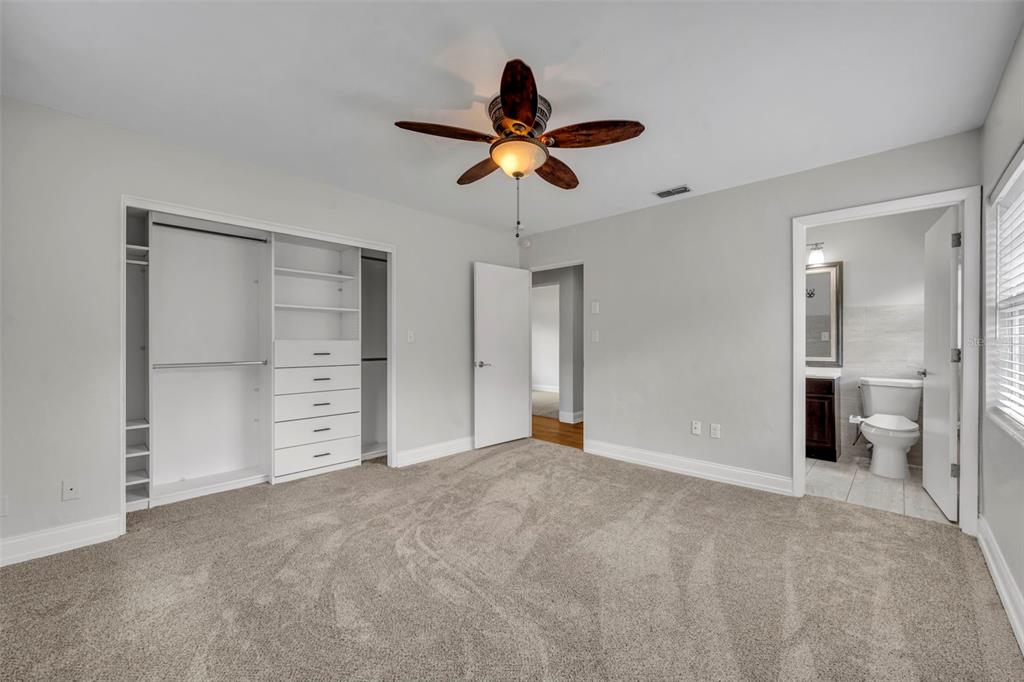 4234 Kendrick Road Orlando, FL 32804 - Photo 28 of 46 a view of a room with cabinet and ceiling fan