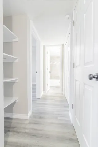 a view of an entryway with wooden floor