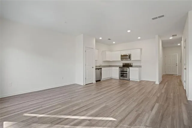 a view of kitchen with wooden floor