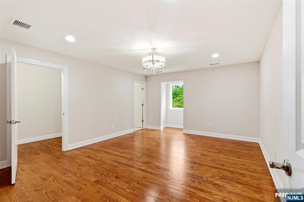 767 Orangeburgh Road River Vale, NJ 07675 - Photo 29 of 49 a view of an empty room with window and wooden floor