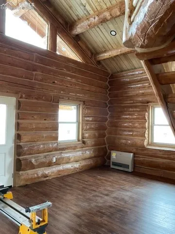 a view of backyard with wooden floor and window