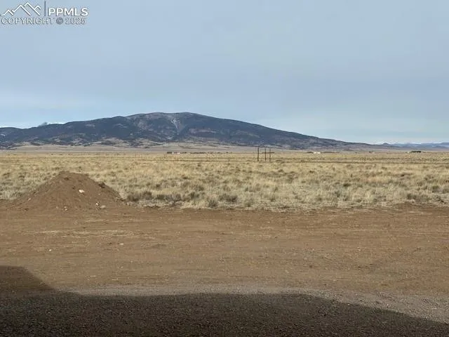 a view of an ocean beach and mountain