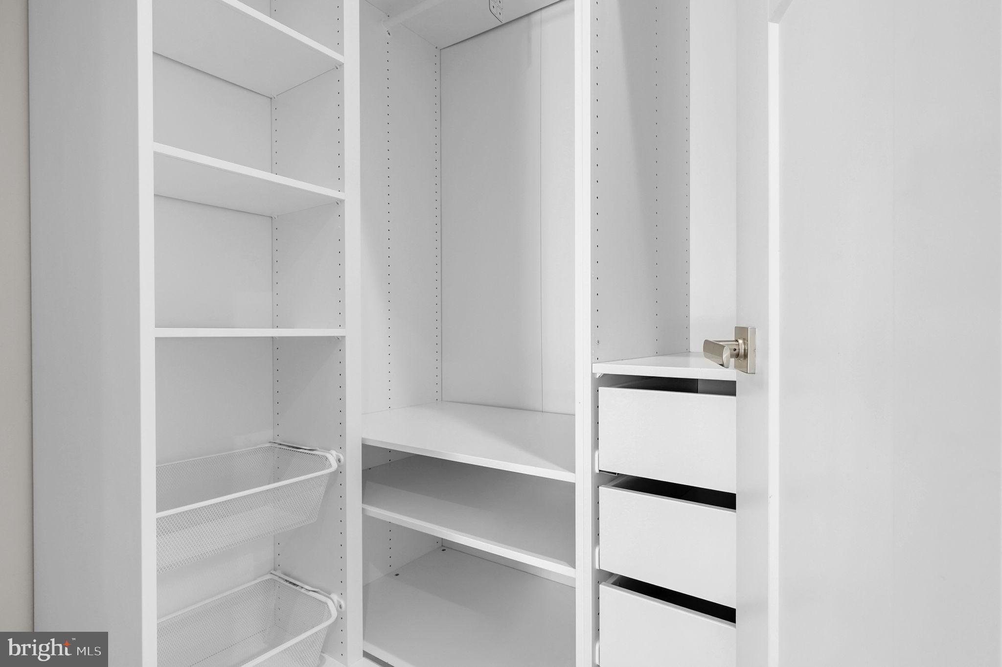 6129 Dock Street Frederick, MD 21703 - Photo 17 of 33 a view of walk in closet with empty racks