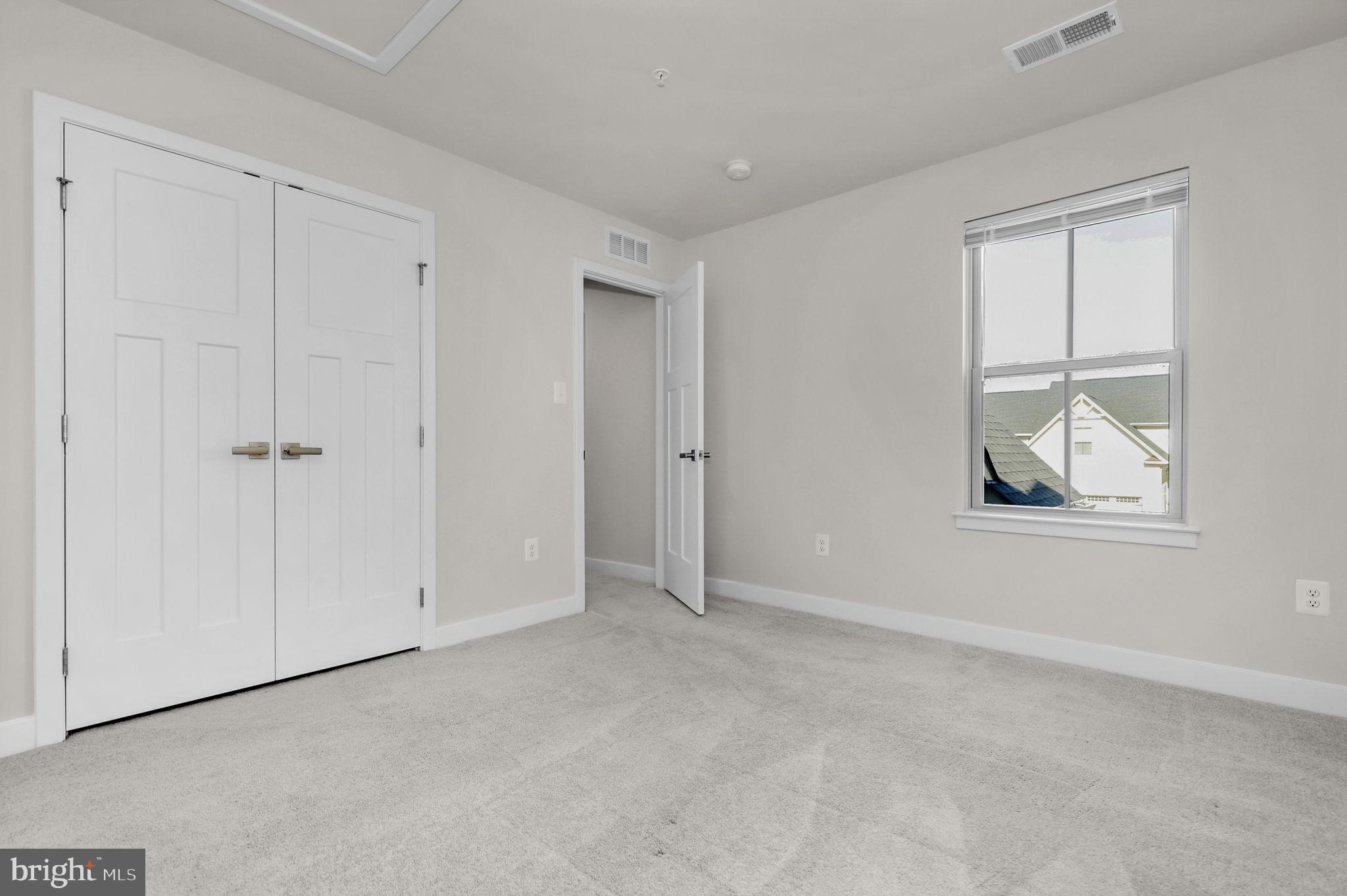 6129 Dock Street Frederick, MD 21703 - Photo 23 of 33 a view of an empty room with a window