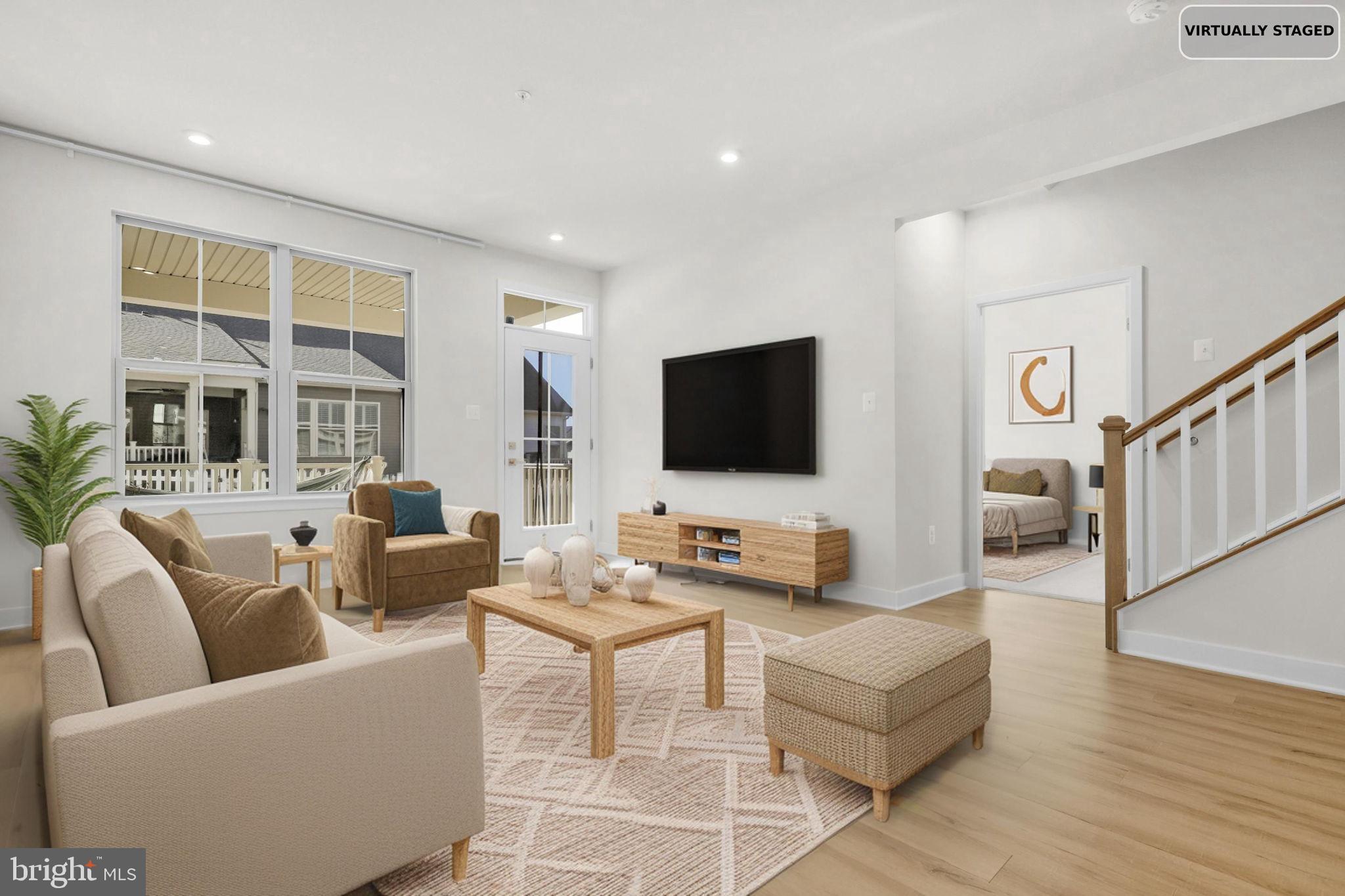 6129 Dock Street Frederick, MD 21703 - Photo 10 of 33 a living room with furniture wooden floor and a flat screen tv