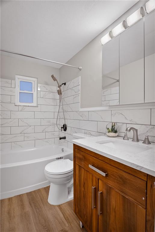 6361 Leechburg Road Verona, PA 15147 - Photo 16 of 26 a bathroom with a granite countertop sink a toilet and shower