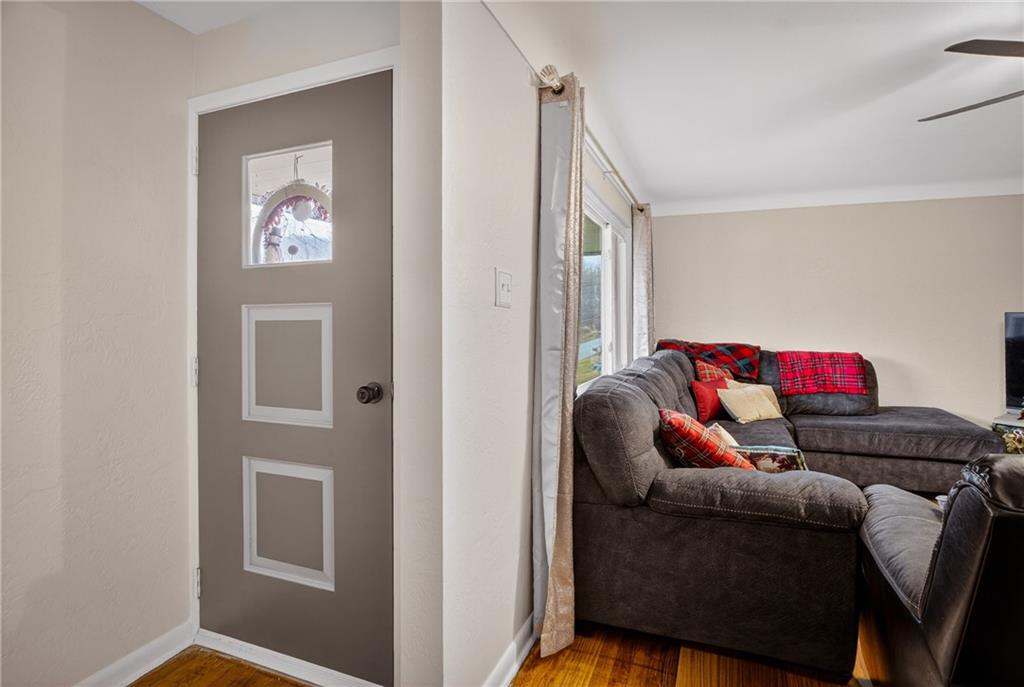 6361 Leechburg Road Verona, PA 15147 - Photo 3 of 26 a living room with furniture and a window
