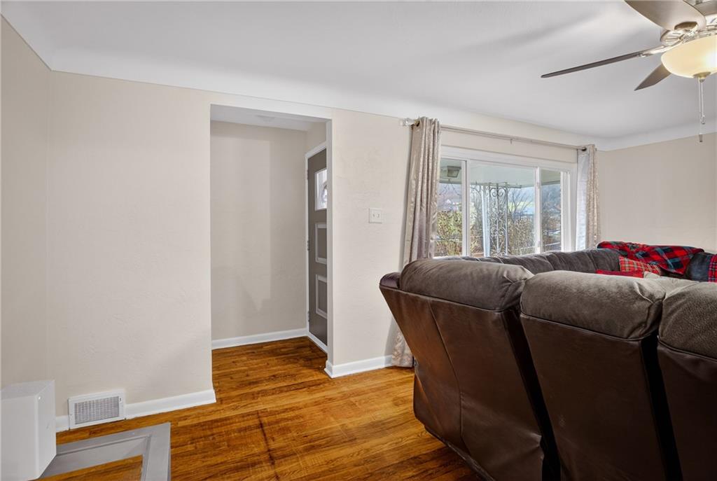 6361 Leechburg Road Verona, PA 15147 - Photo 5 of 26 a living room with furniture and wooden floor
