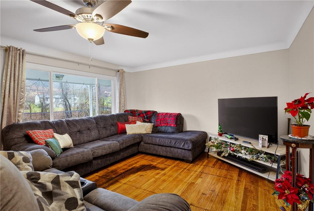 6361 Leechburg Road Verona, PA 15147 - Photo 6 of 26 a living room with furniture and a flat screen tv